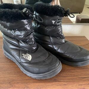 Black North Face puffer boots. Super warm, and VERY light. Perfect for snow